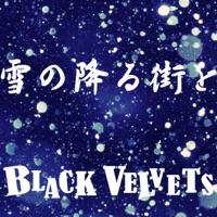 雪の降る街を