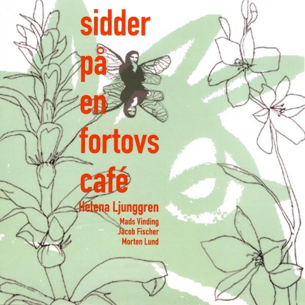 Sidder På En Fortovscafé